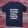 Navy T-shirt with bold white text saying "A bad day of fishing beats a good day of work," shown on a light blue background.