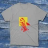 grey fishing T-shirt on a light blue background featuring a fish drawing with a cross as its eye, set against a yellow block.