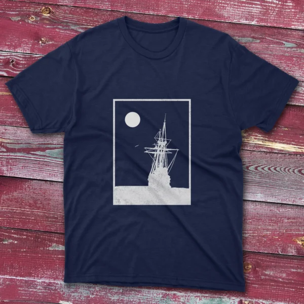 Navy T-shirt with a white square stroke design of an old ship landing on the ocean, shown on a light blue background.