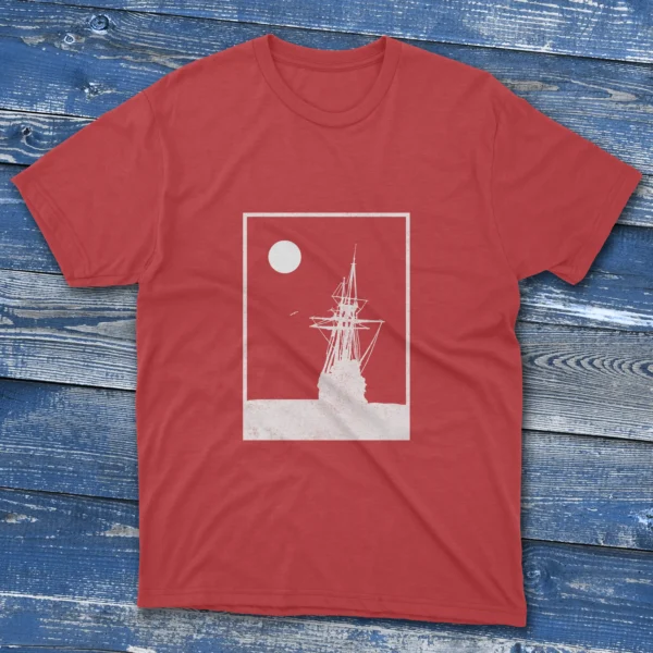 Red T-shirt with a white square stroke design of an old ship landing on the ocean, shown on a light blue background.