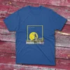 A modern look design of a royal fishing T-shirt, the design has the quote The fishing was good, it was the catching that was bad and an image of a man fishing on a lake. with yellow shapes in the design