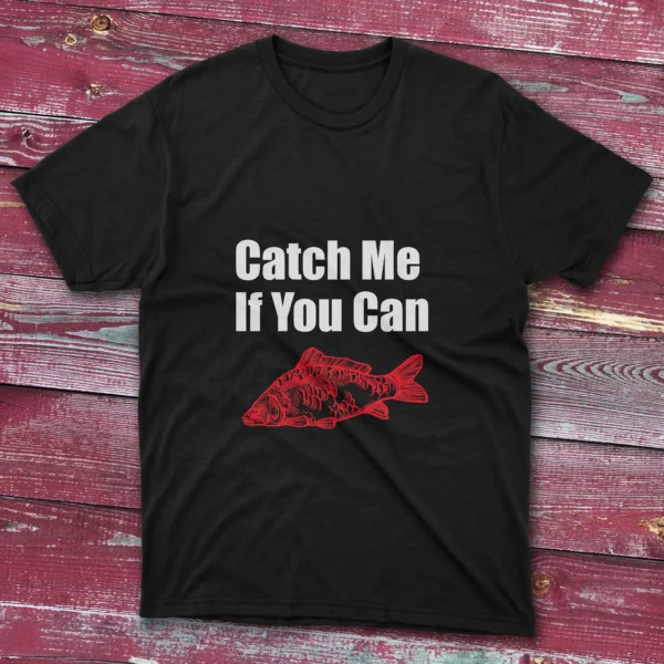 Black fishing T-shirt featuring the phrase "Catch me if you can" in bold white text with a red fish illustration, set against a light blue background.