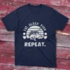 Navy blue T-shirt featuring Eat Sleep Fish Repeat - 2025 text